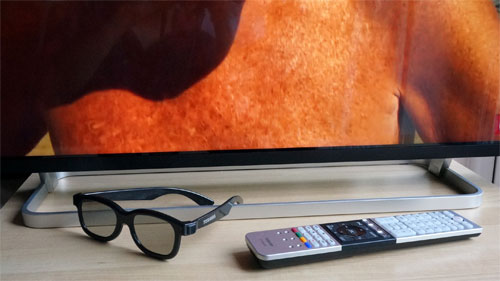 Stand, remote control and polarized 3D glasses